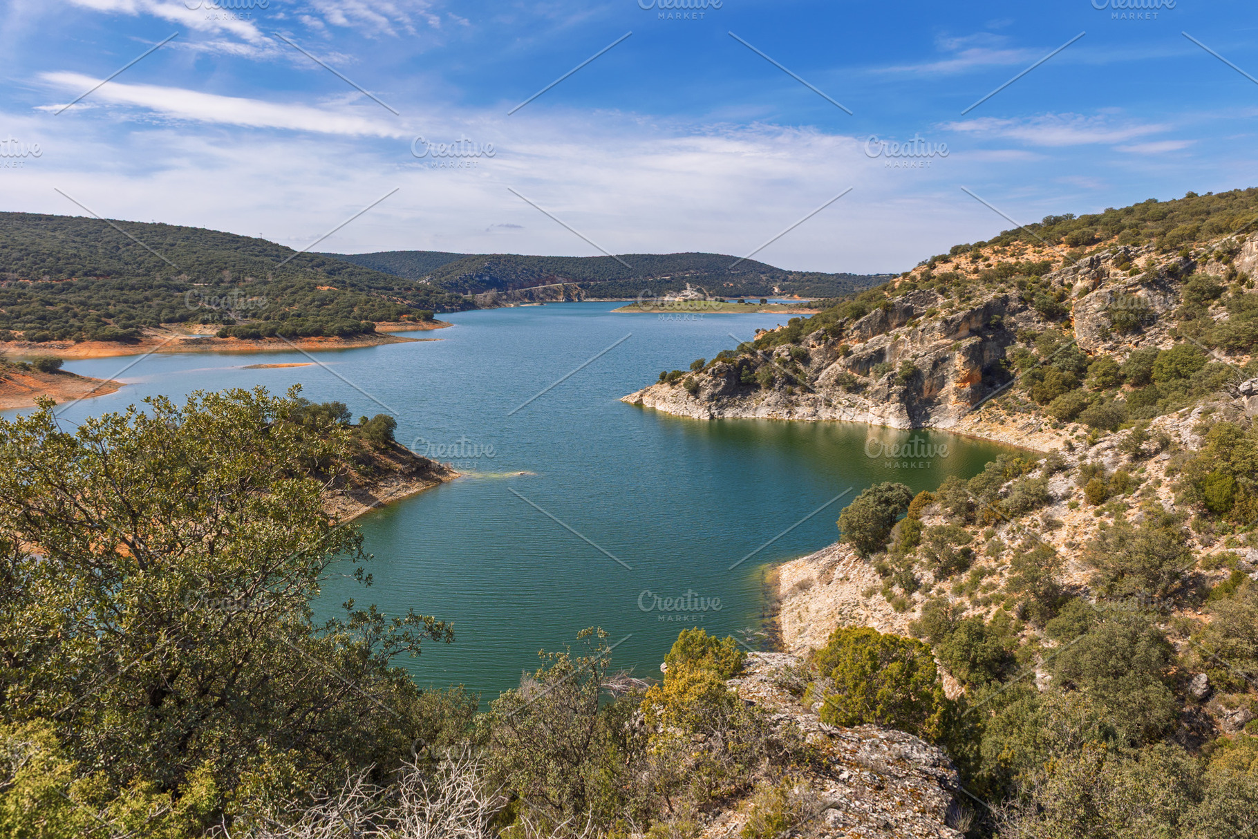 Water reservoir nestled among mounta, a Nature Photo by Perpis