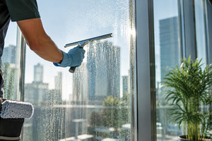 Window cleaning in a city setting, a Photo by Beautiful things