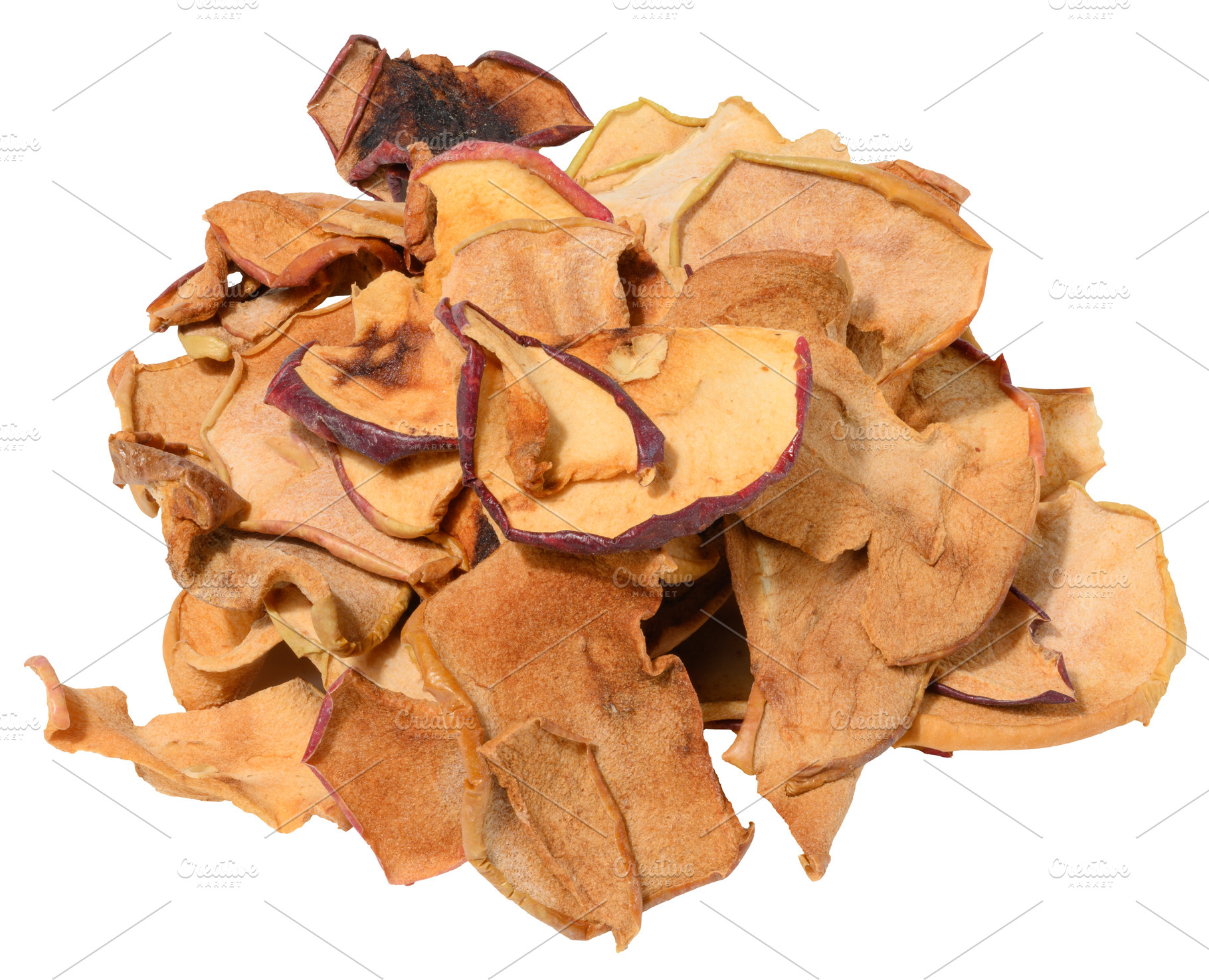 A heap of thin, crispy dried apple slices with varying shades of, a Photo by ndanko