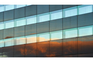 Evening clouds reflected in the, an Architecture Photo by Oleksandr Berezko