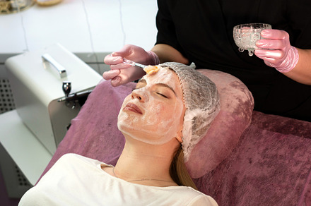 Esthetician applies foaming facial, a Health & Medical Photo by Elena Vagengeim