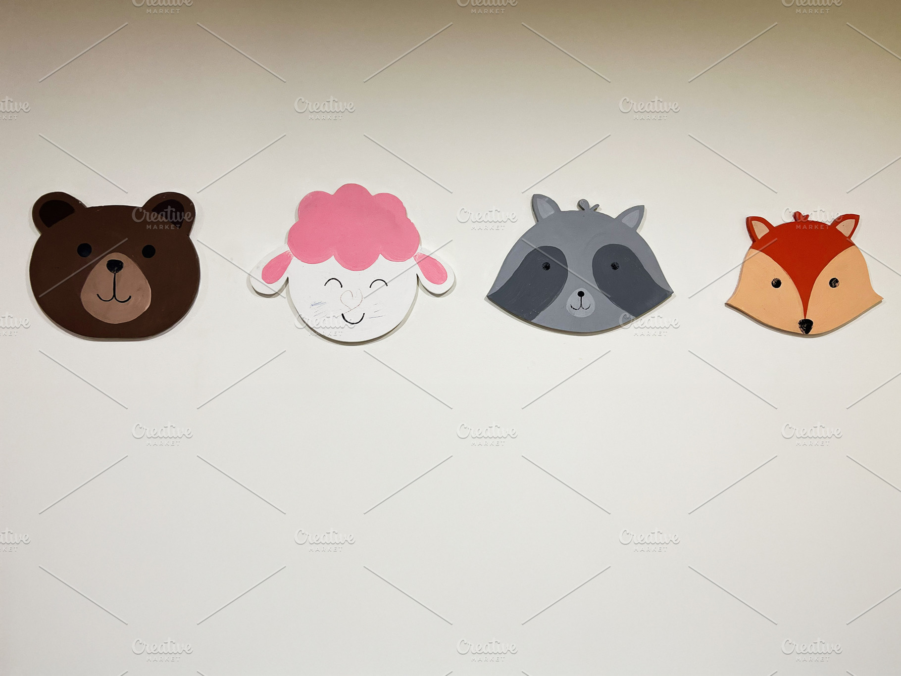 Cute animal faces wall decorations featuring bear, sheep, raccoon, and fox desi, a Photo by AS photostudio