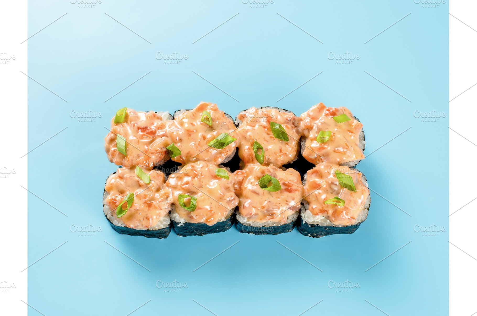 Maki roll with spicy salmon on blue, a Food & Drink Photo by Fascinadora