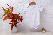 Baby bodysuit mockup with red grass, a Shirt Mockup by TasiPas (Thumbnail 3 of 4)