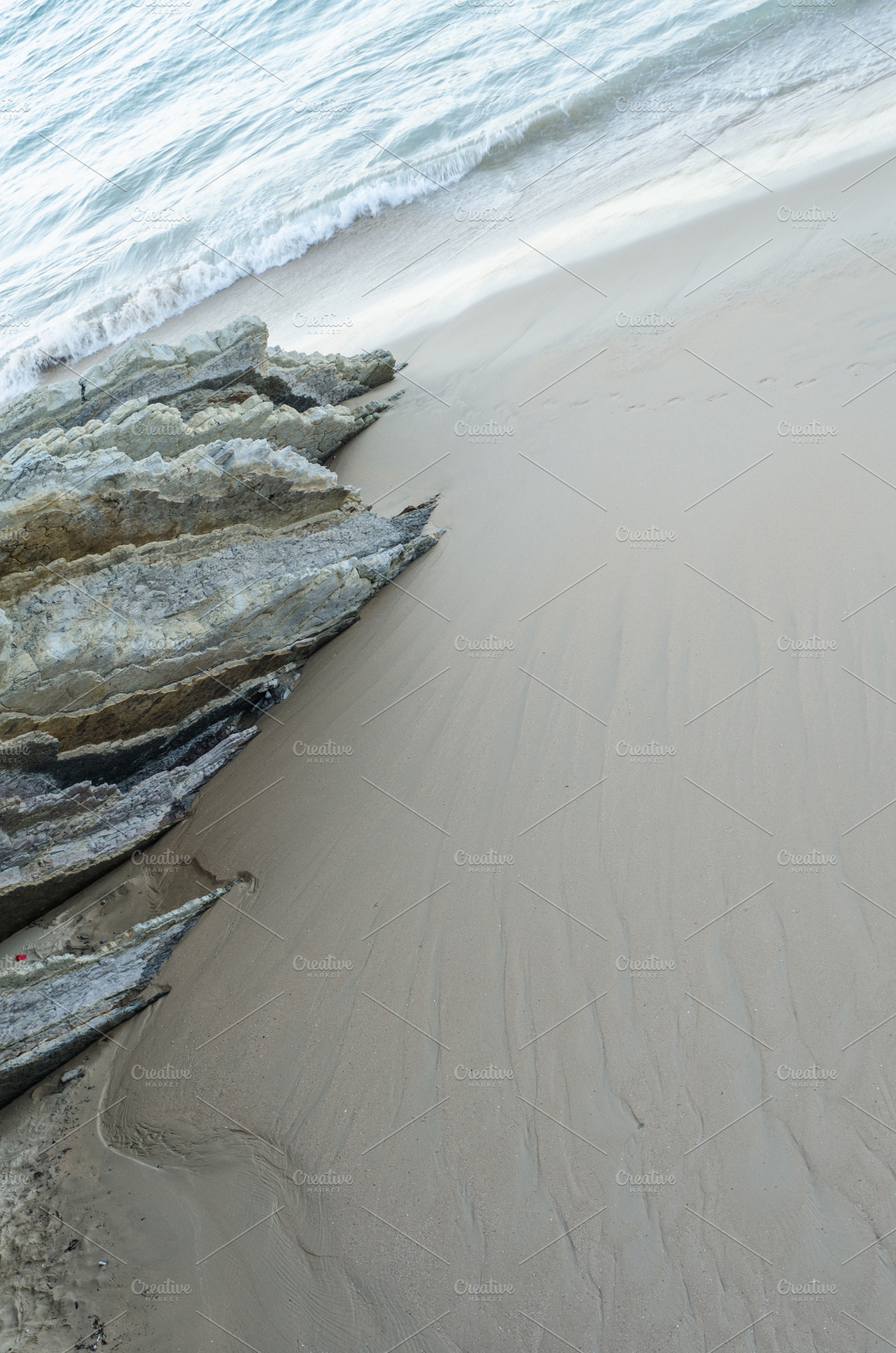 Between de rock, sand and water, a Nature Photo by mikelju's point of view
