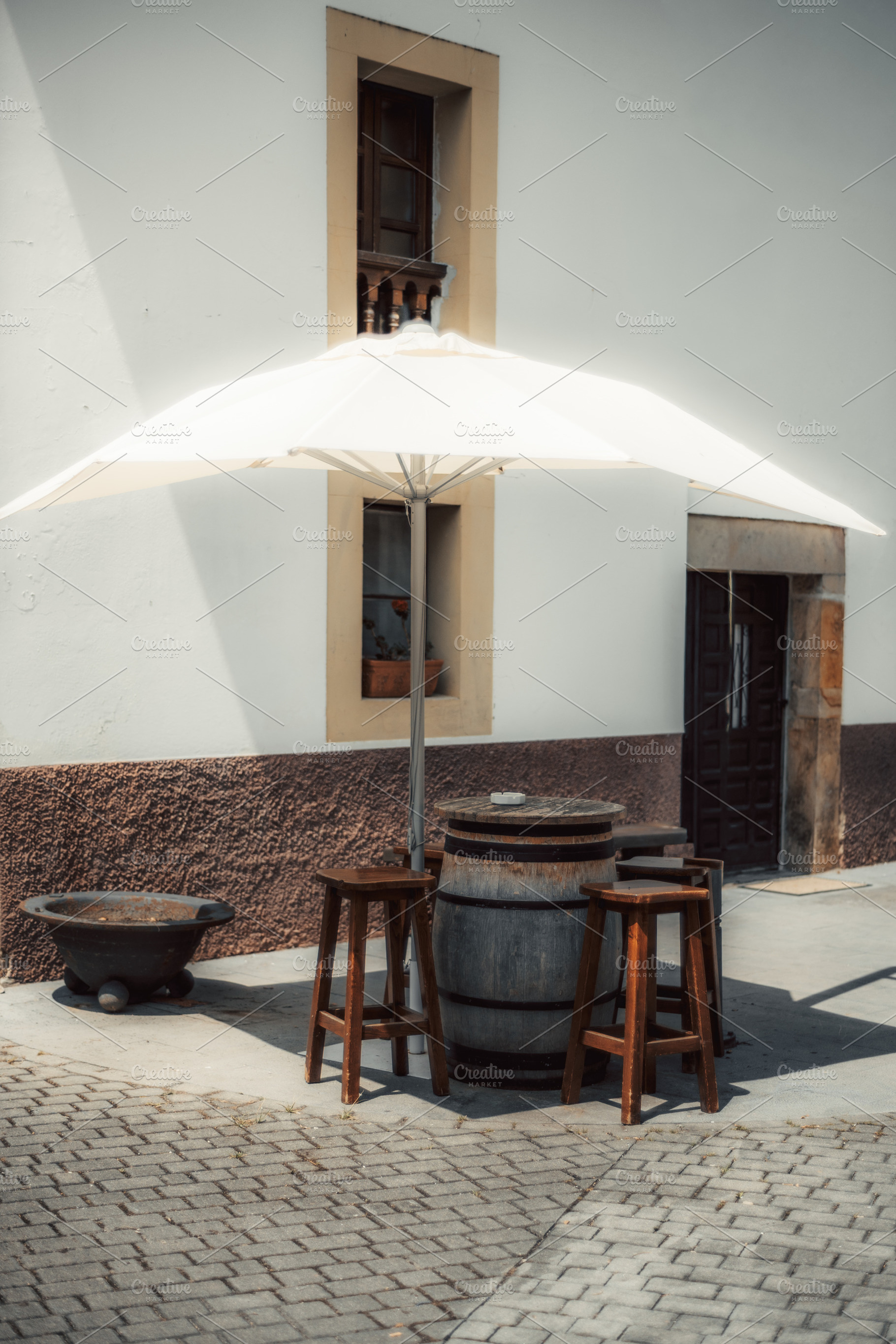 Barrel table with umbrella shade, an Industrial Photo by SkyNext