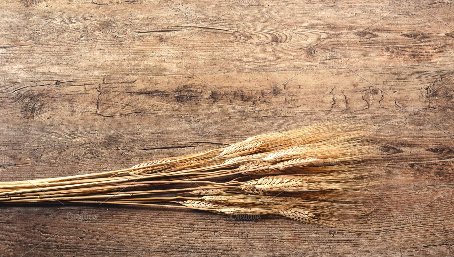 Wheat on wooden background stock photo containing wood and wheat, a Food & Drink Photo by HrastovaSiska