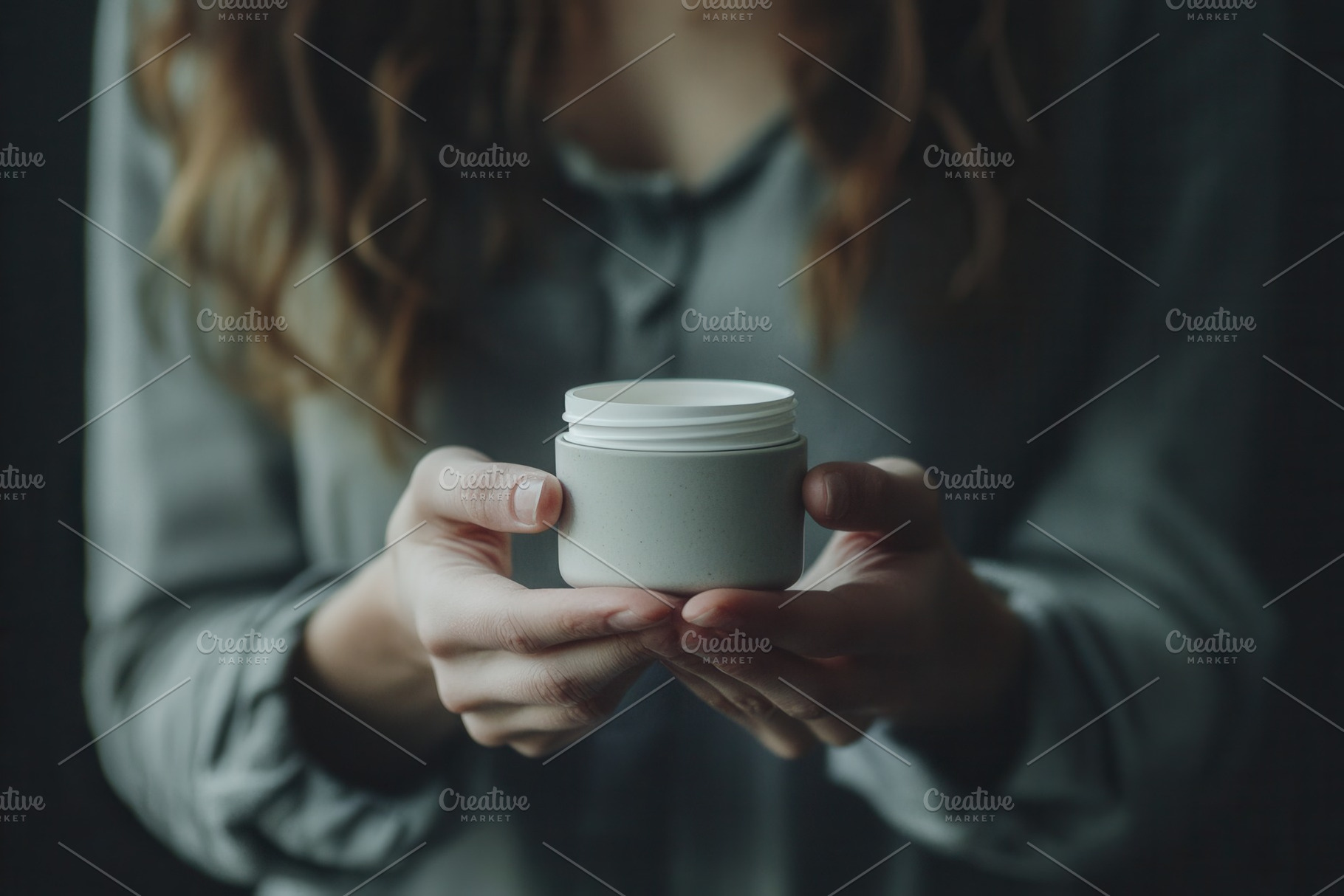 Woman holds delicate cosmetic jar, a Photo by Pavel_design