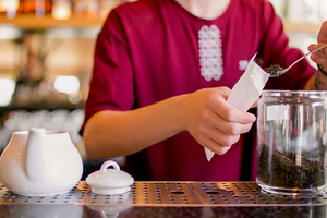 Tea shop preparing sachet drink barista paper pack, a Food & Drink Photo by Photo Drive Studio