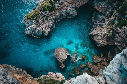 A stunning rocky cove reveals vibran, a Photo by Tanuart