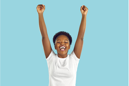 Happy excited African American woman