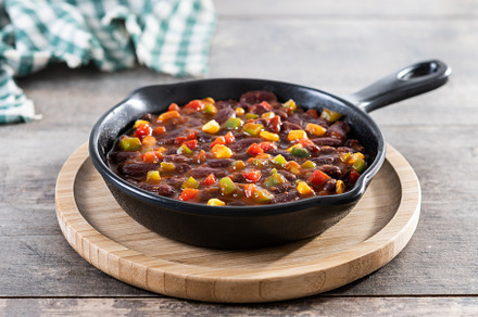 Mexican chilli beans with vegetables in iron pan