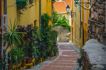 Narrow street with stairs in France, an Architecture Photo by Alpine Dreams