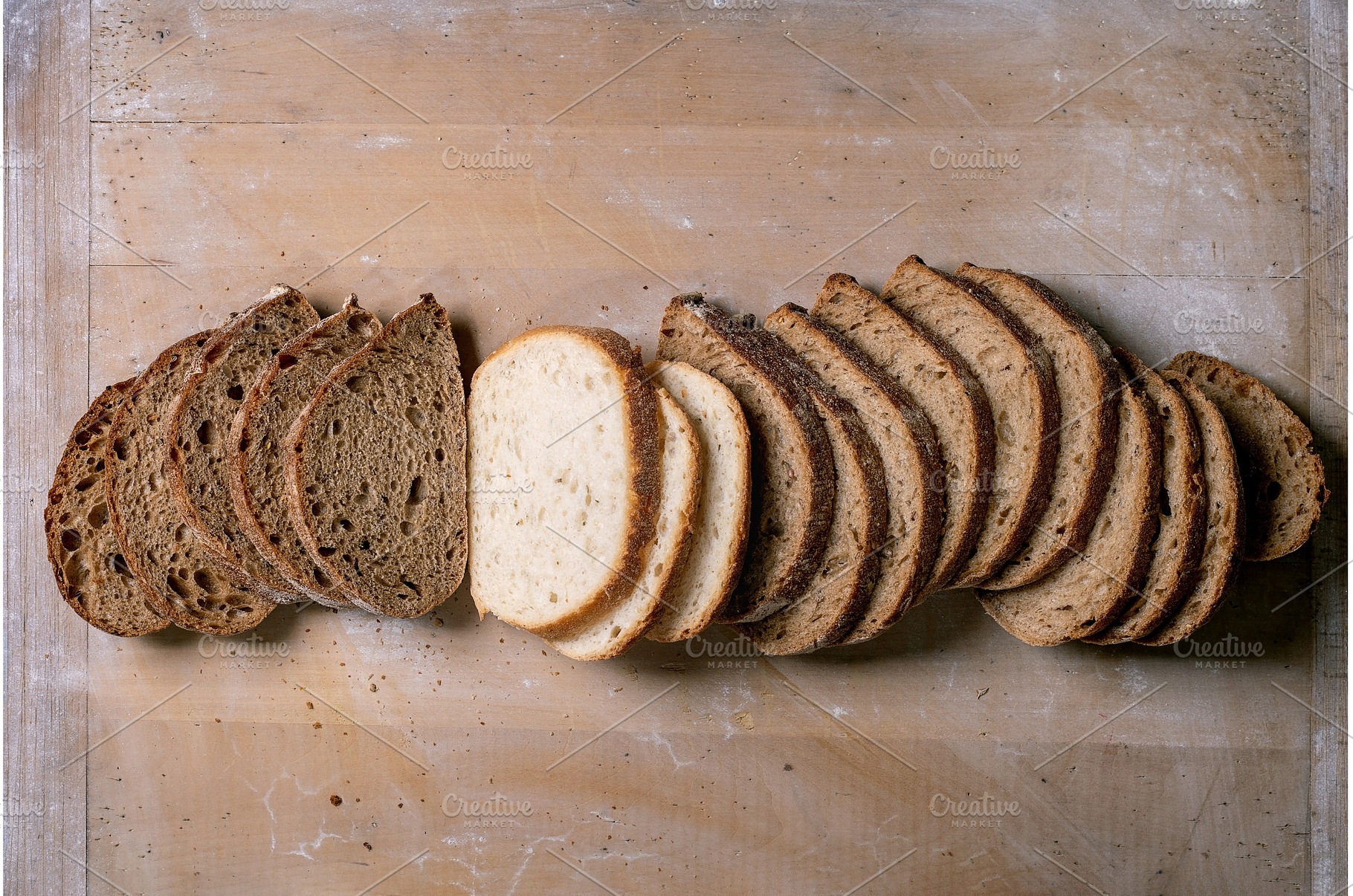 Variety of Sliced Bread on Board, a Food & Drink Photo by Natasha Breen