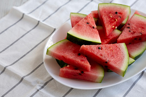 Raw Organic Watermelon Slices on a Plate, side view. Copy space., a Food & Drink Photo by LiudmylaChuhunova
