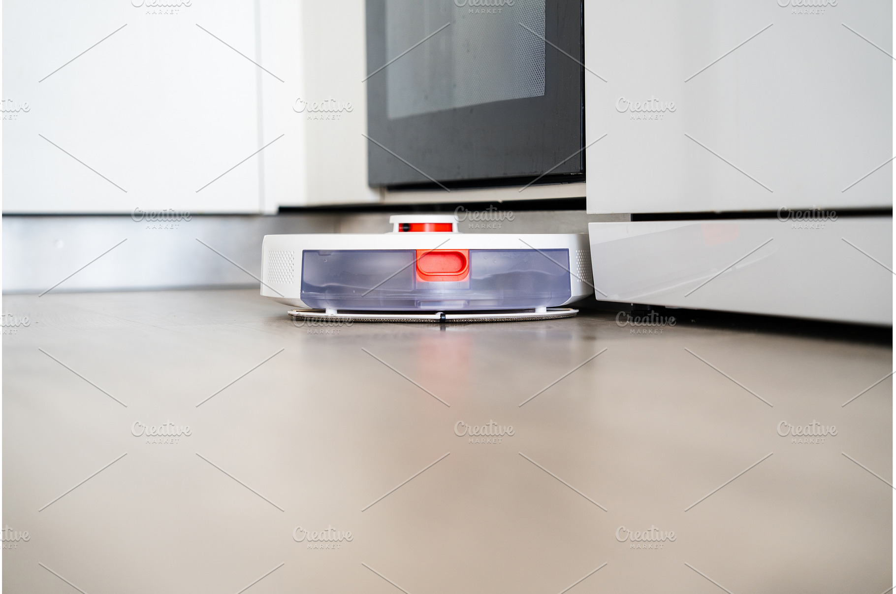 Robot vacuum cleaner cleaning floor, a Technology Photo by volodymyrshtun13795
