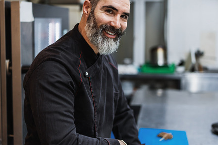 Professional chef preparing food, a Person Photo by REDDOT Studio