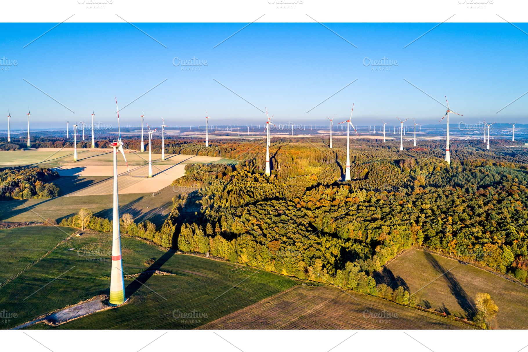Aerial view of a wind farm in stock photo containing wind and turbine, an Industrial Photo by Leonid Andronov