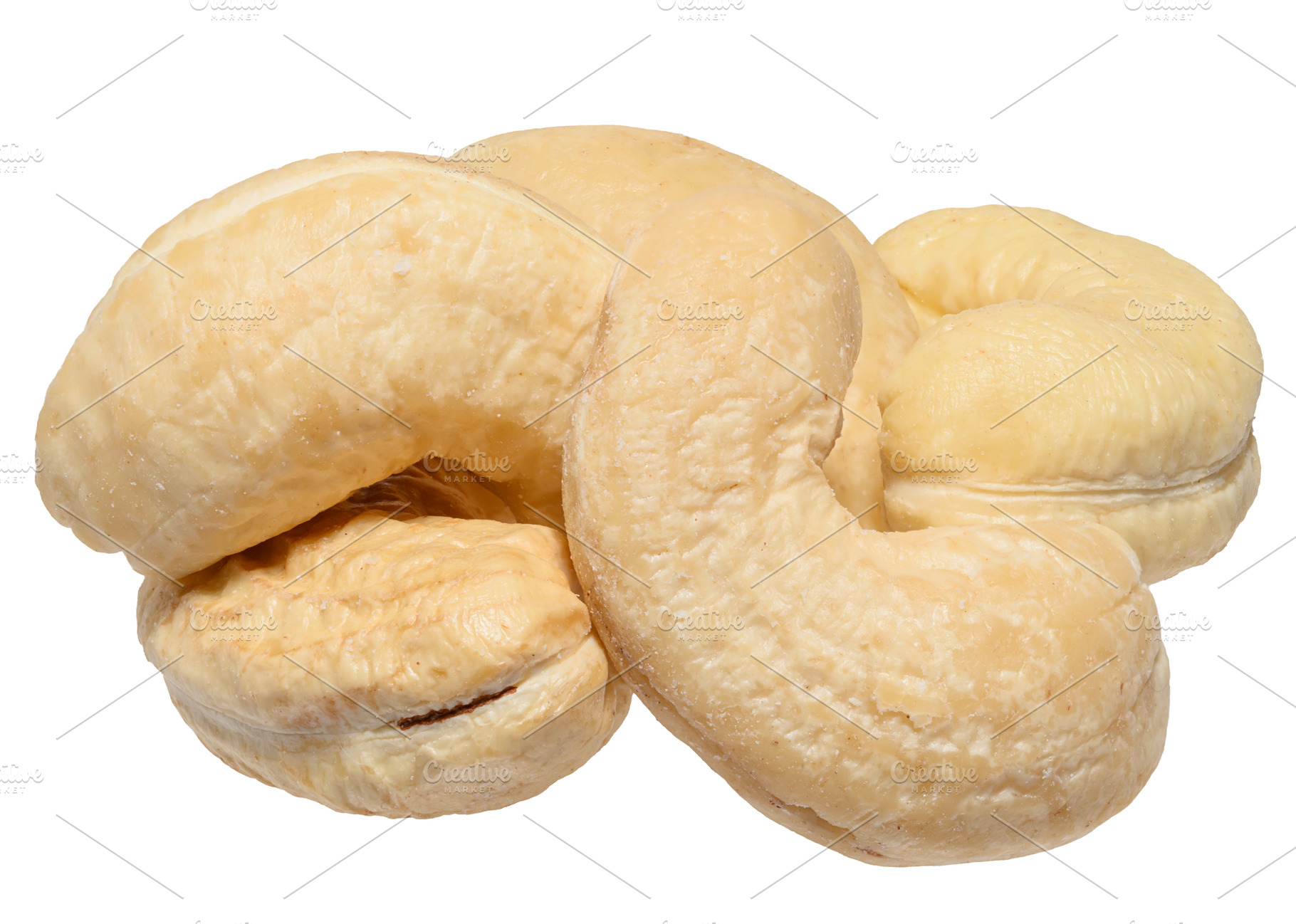 Heap of peeled cashew nuts on isolated background, close up, a Food & Drink Photo by ndanko