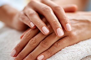 Hands with neatly manicured nails resting on a towel after a beauty treatment s, a Beauty & Fashion Photo by AlyaAnd