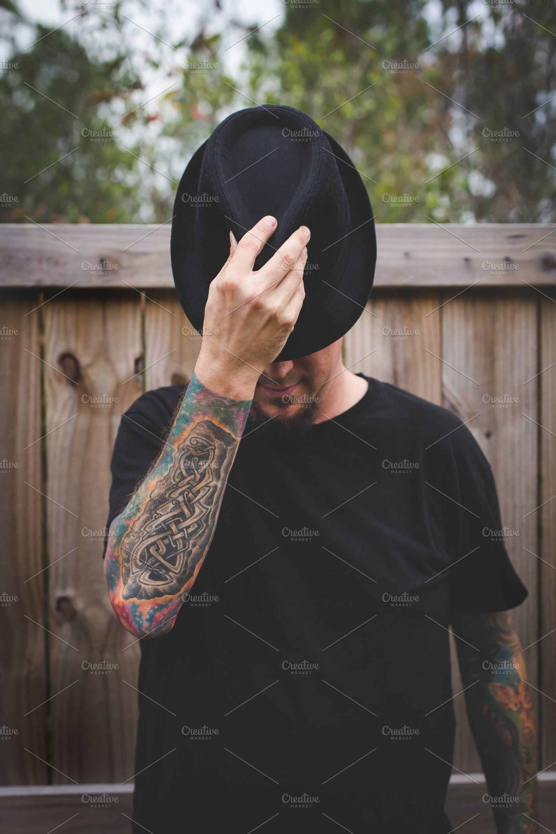 Tattooed Man in Black, a Person Photo by Tamara Lance