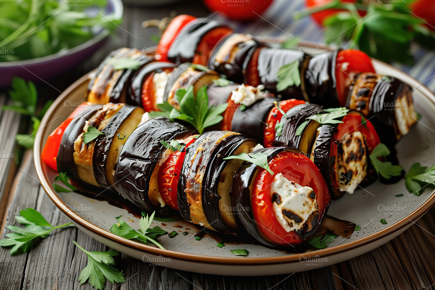 Rolled up eggplant stuffed with cheese and tomatoes in plate, a Food & Drink Photo by AlyaAnd