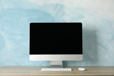 Workplace with computer screen on wood table, space for text, a Business Photo by AtlasStudio