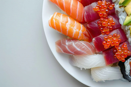 Assorted tasty sushi food in plate on white background, a Food & Drink Photo by AlyaAnd