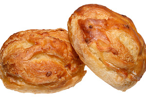 Baked round shaped puff pastry bun with filling on isolated back, a Food & Drink Photo by ndanko