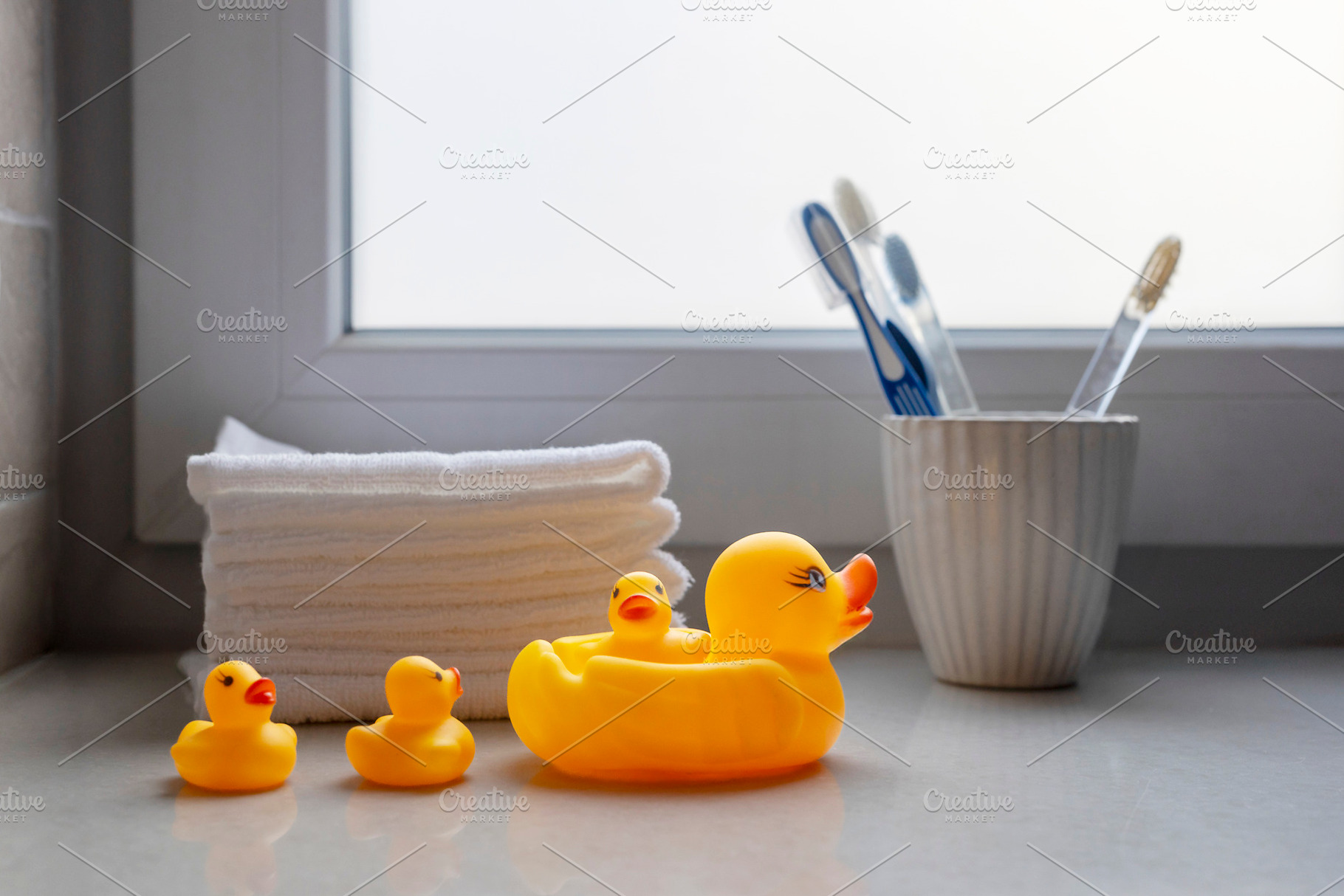 Family of yellow rubber ducks in a r, an Abstract Photo by Imaginarium