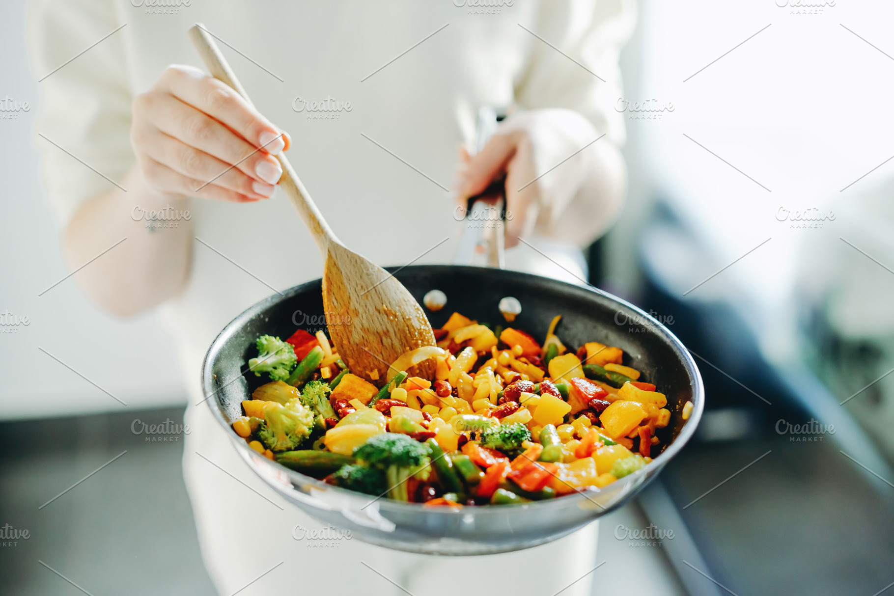 Woman cooking vegetables on pan, a Food & Drink Photo by Valeria Art