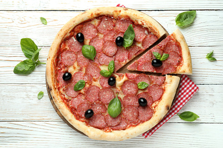 Concept of tasty food with Salami pizza on white wooden backgrou, a Food & Drink Photo by AtlasStudio PRO