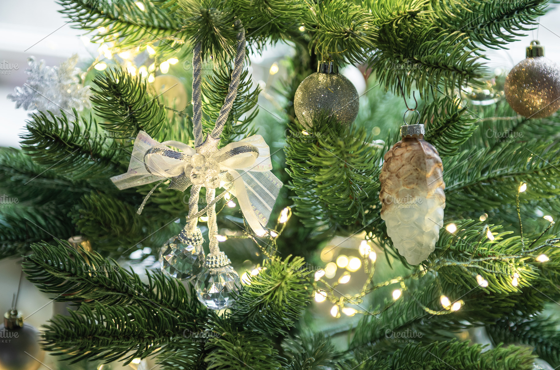 Christmas tree decorating with festive ornaments and lights, a Holiday Photo by Olena Rudo