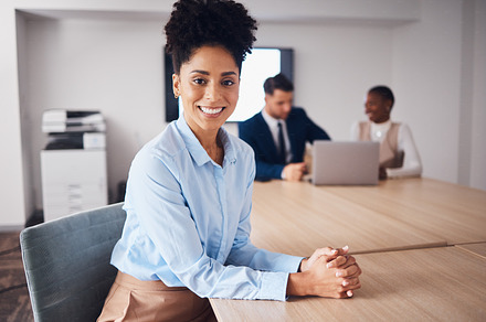 Happy, smile and portrait of black woman in boardroom for meeting, planning and conference. Executive, professional and confident with employee at company for positive, strategy and opportunity, a Photo by Peopleimages.com