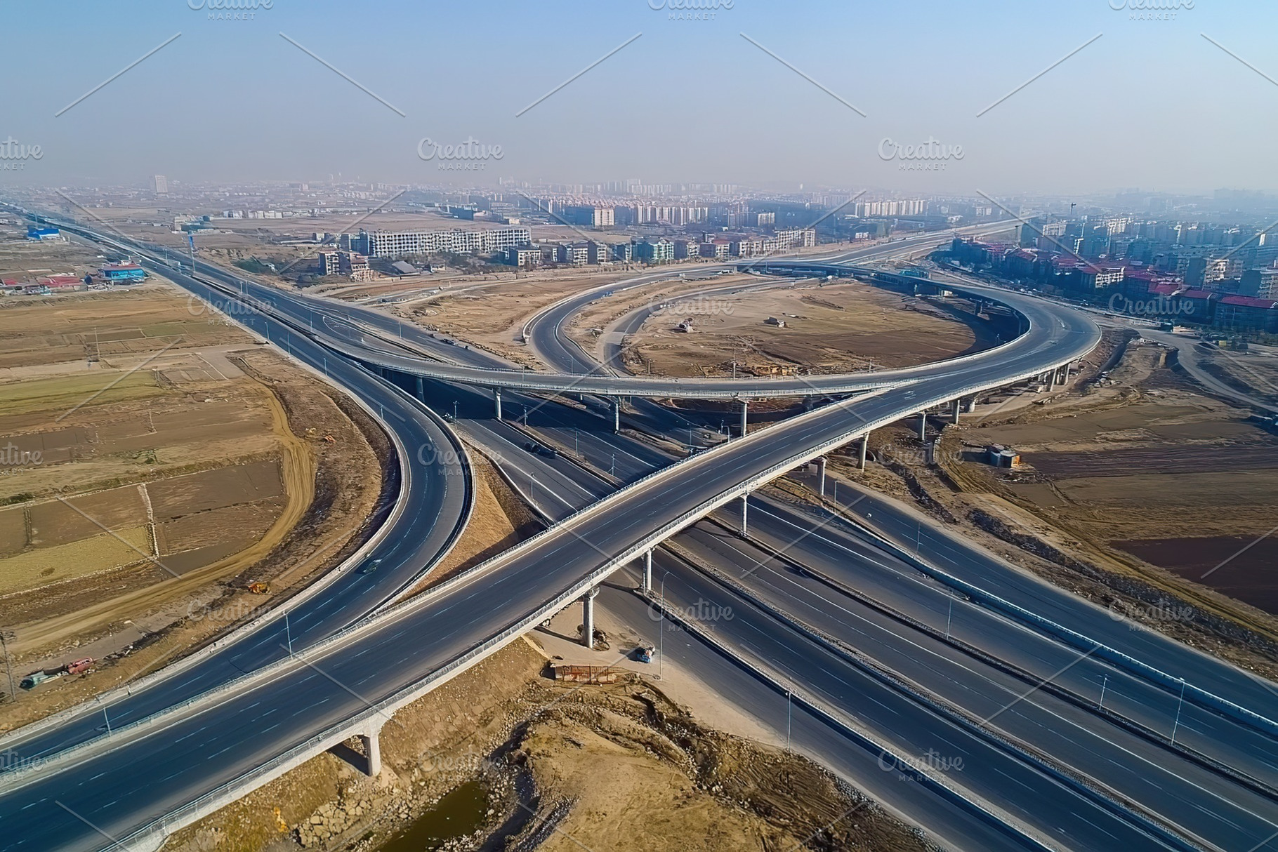 Top view photo of multilevel bridge highway road, an Industrial Photo by AlyaAnd
