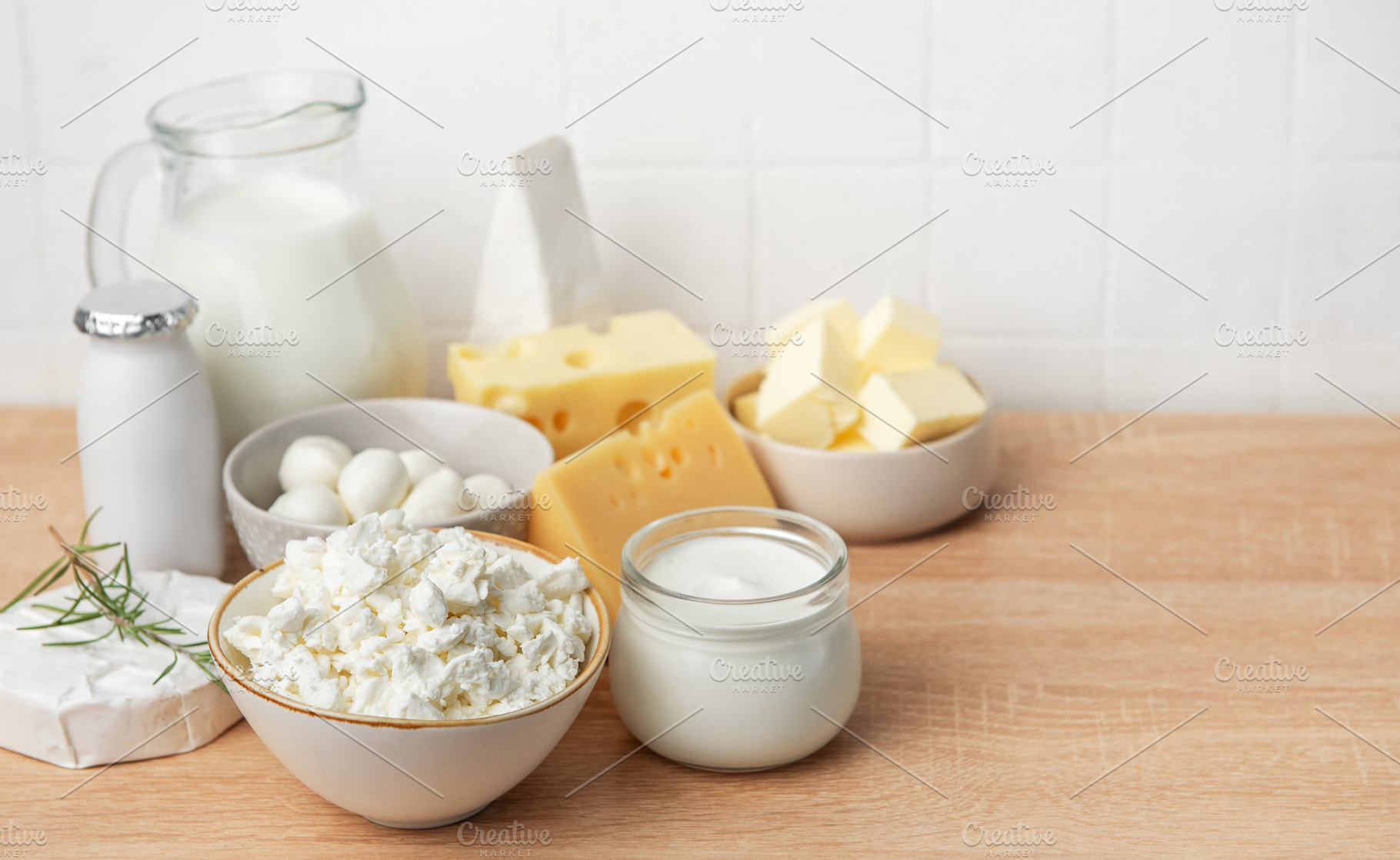 Assorted dairy products offering fresh healthy nutrition on wood, a Food & Drink Photo by Olena Rudo