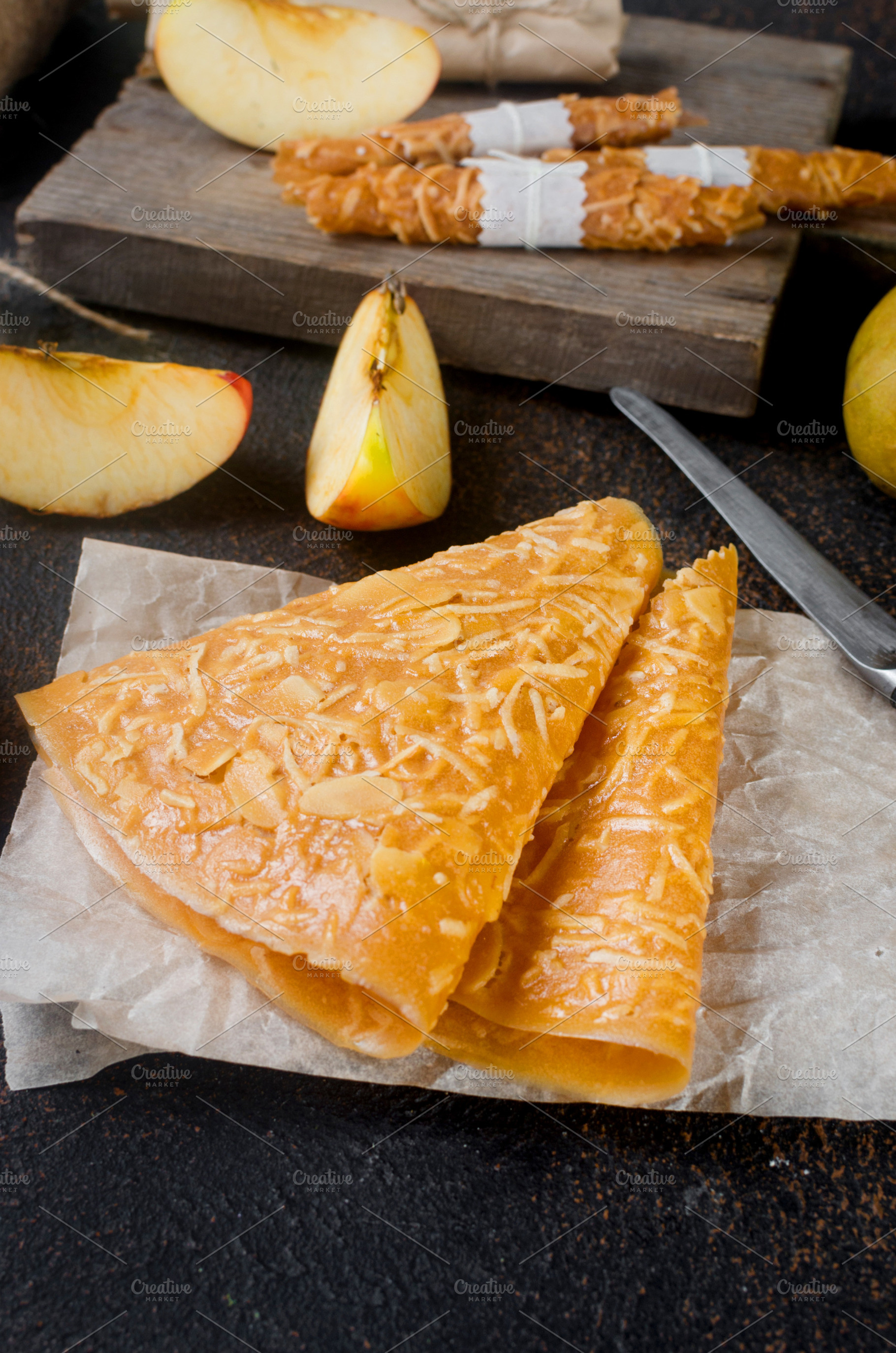 Delicious apple fruit leather on a board, a Food & Drink Photo by vimart