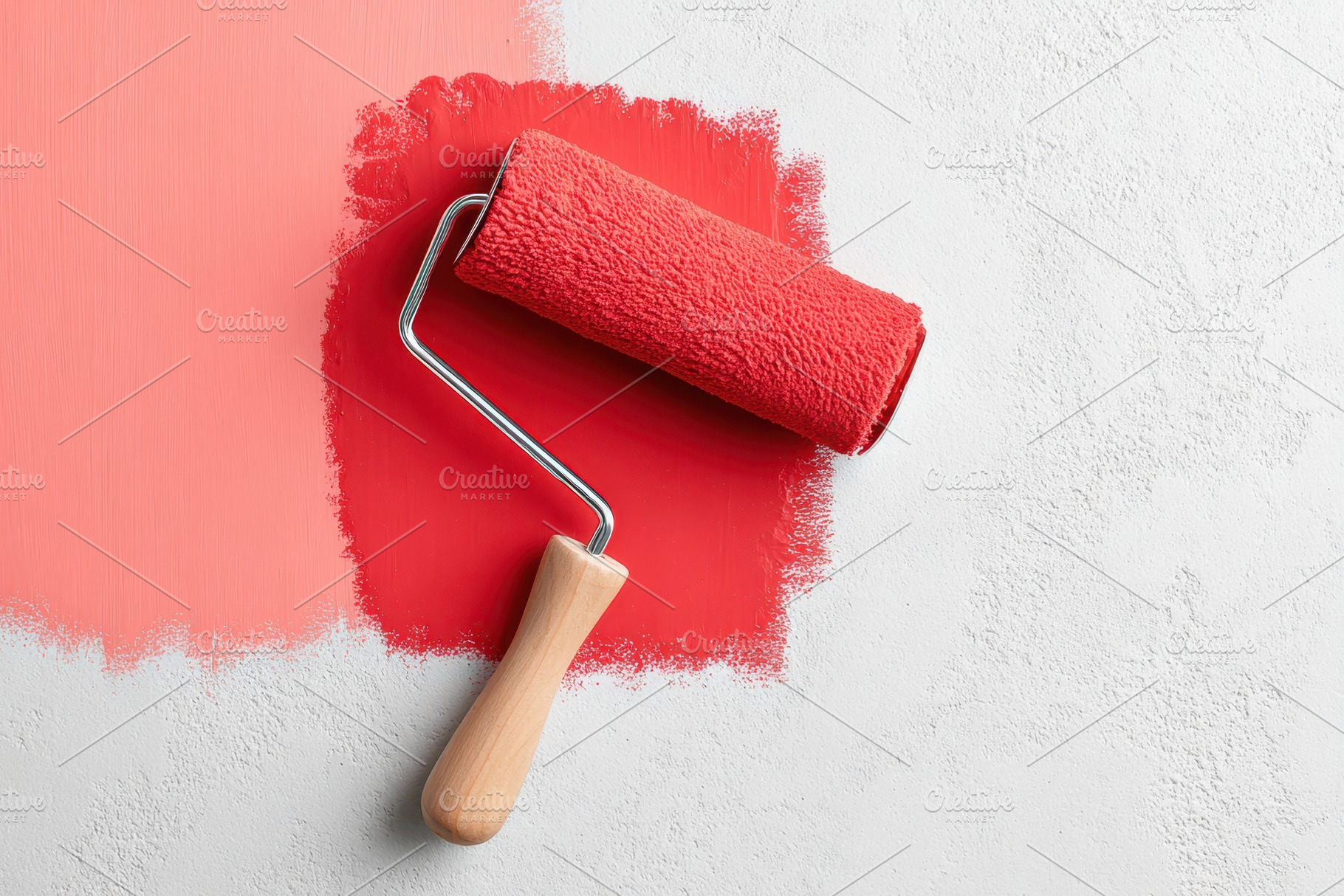Red paint roller on white textured wall, an Arts & Entertainment Photo by AlyaAnd