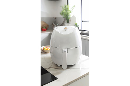 Air Fryer in Modern Kitchen Setting, a Food & Drink Photo by Lermont51