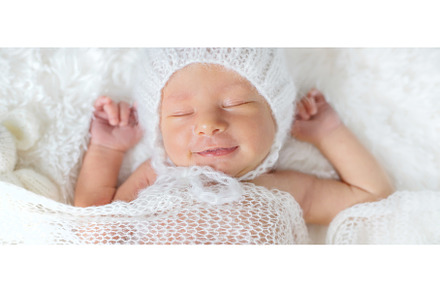 Newborn baby sleeps in a hat, a Beauty & Fashion Photo by yanadjana
