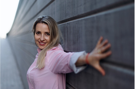 Young blond woman standing in front, a Person Photo by HalfPoint