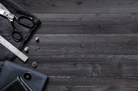 Black wooden sewing background featuring sewing, accessories, and tool, an Arts & Entertainment Photo by AlinaKho