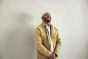 Modern businessman laughing happily in an office, a Person Photo by Jacob Lund