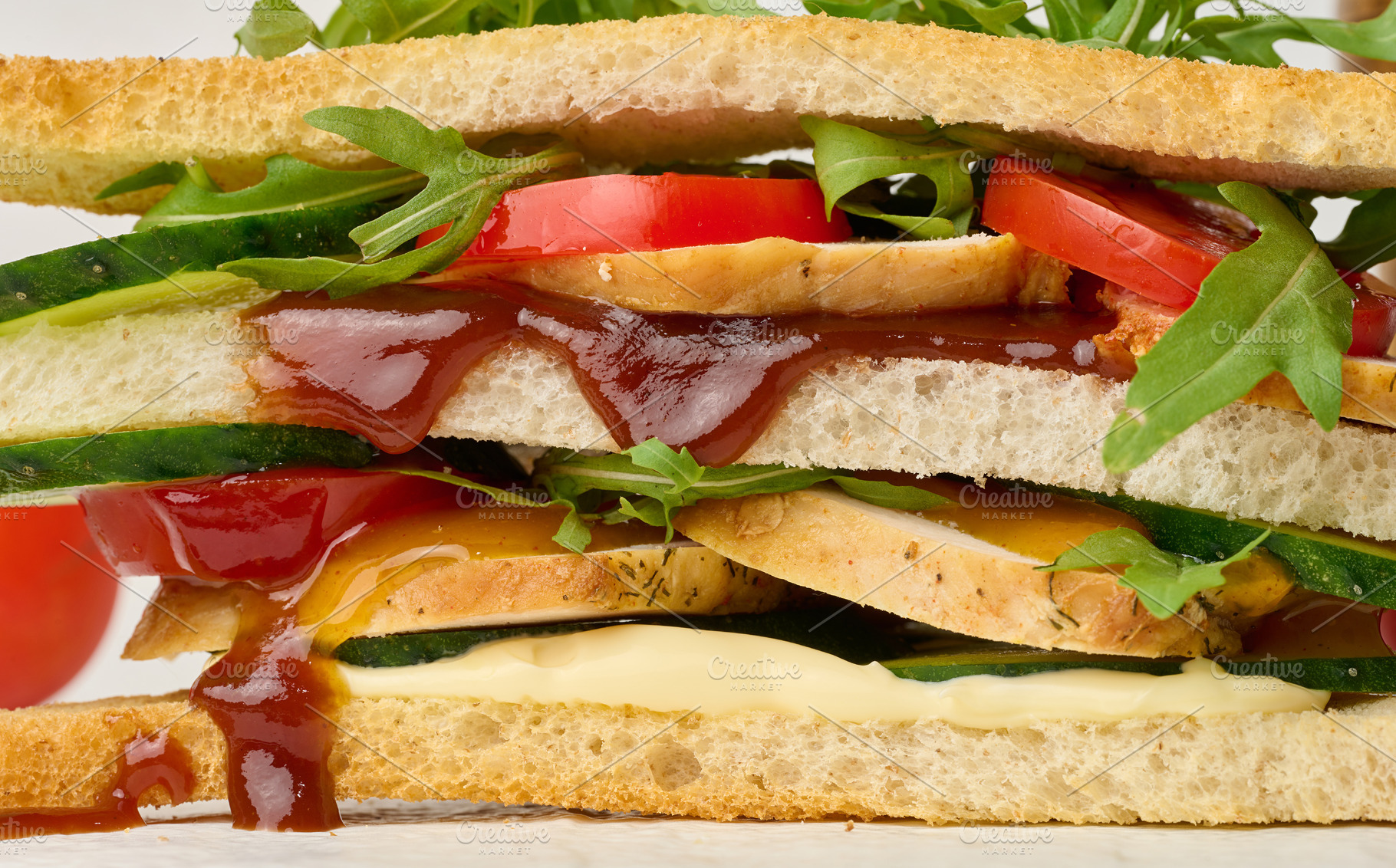 Multilayer sandwich with chicken, fresh cucumber, tomato and aru, a Food & Drink Photo by ndanko