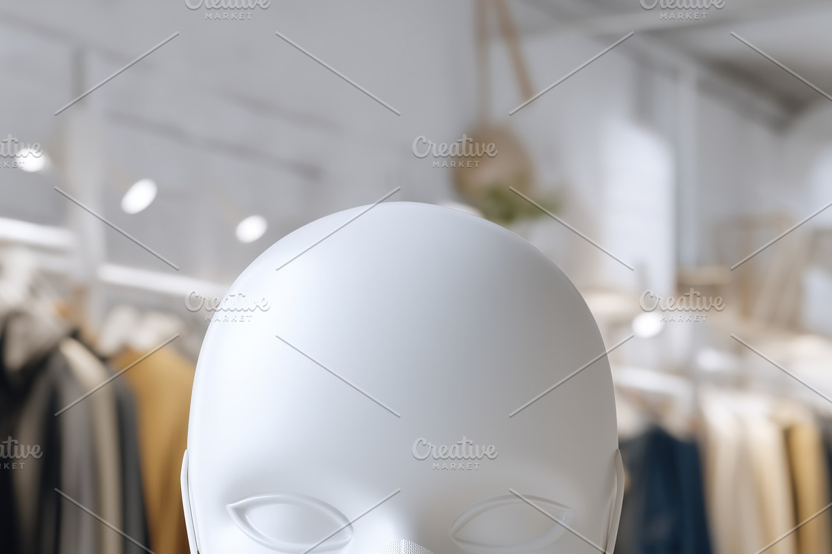 A white mannequin head wearing a white face mask mockup in a clothing store wit, a Mask Mockup by Textures & Backgrounds