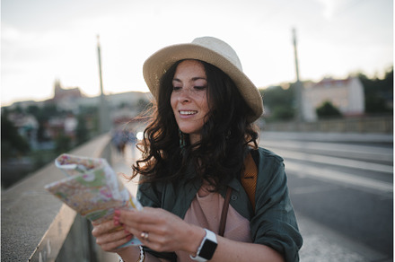 Young beautiful female traveler with, a Person Photo by HalfPoint