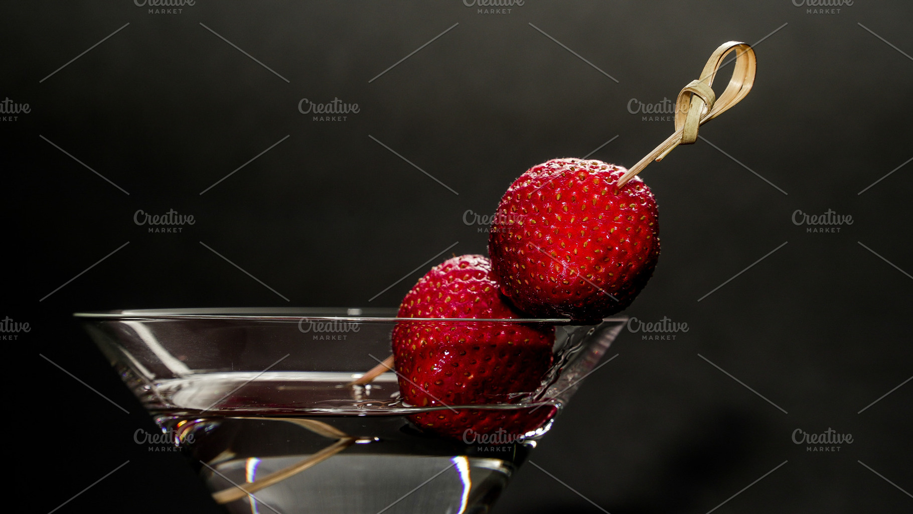Strawberries garnishing martini glas, a Photo by 1miromiro