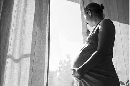 Pregnant woman touching belly, a Person Photo by Koldunova