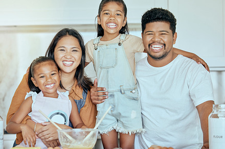 Baking, children and parents in the kitchen for food, dinner or lunch with smile in their house. Portrait of a happy, excited and mother and father with love while cooking breakfast with kids, a Photo by Peopleimages.com