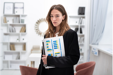 Portrait of a young woman standing, a Business Photo by undrey